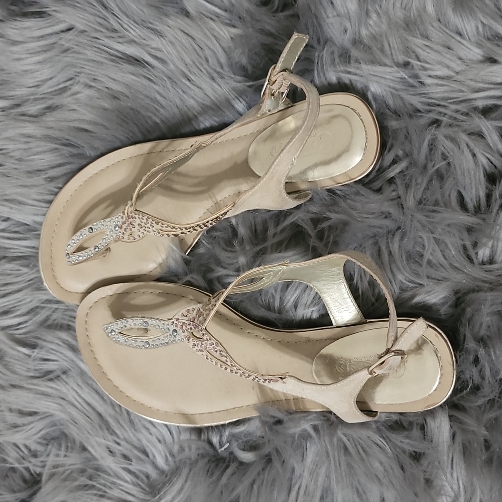 Gold and tan colored sandals